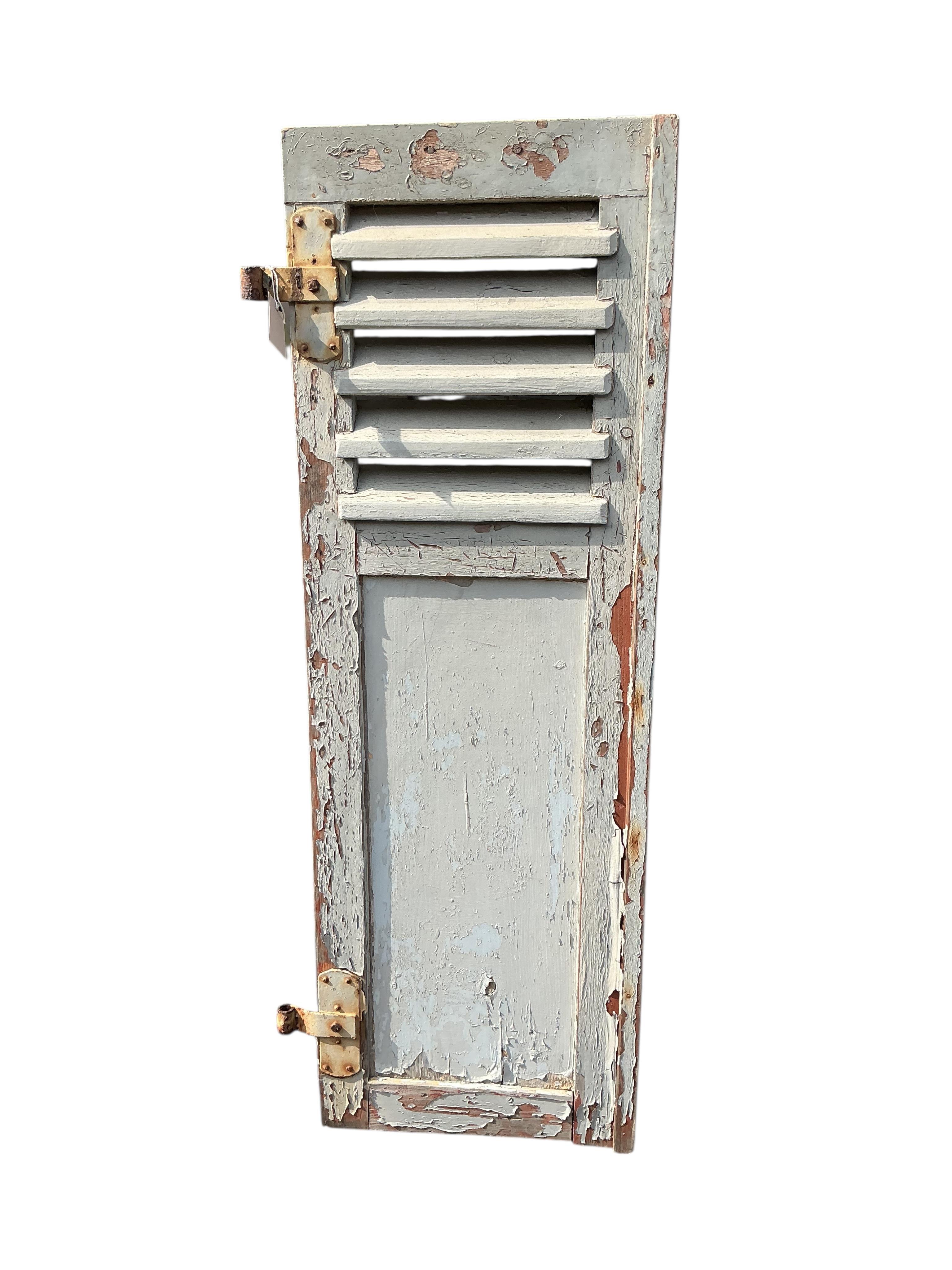 A pair of French painted wood window shutters, each width 43cm, height 130cm